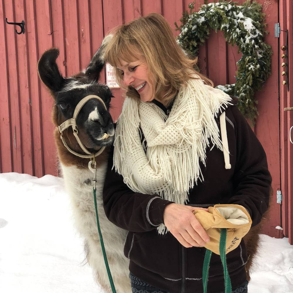 Portrait of Tina Shoup and a llama